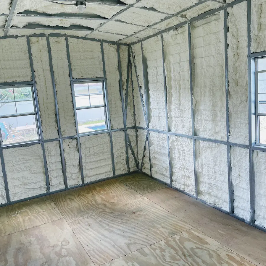 Closed-cell spray foam insulation applied to wall cavities in a residential project in Perryton